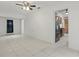 Open living area with tile floors, leading to the kitchen and rear of the home at 62 Magnolia Dr, Debary, FL 32713