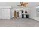 Covered patio with tile floors, fan, and convenient fridge- perfect for outdoor kitchen or entertainment space at 62 Magnolia Dr, Debary, FL 32713