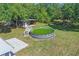 Backyard with an above-ground pool, shed, and spacious grassy area at 62 Magnolia Dr, Debary, FL 32713