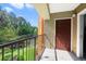 Balcony with a serene view of a pond at 725 Crest Pines Dr # 422, Orlando, FL 32828