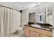 Bathroom featuring a vanity with dark countertop, sink, and shower with curtain at 725 Crest Pines Dr # 422, Orlando, FL 32828