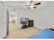Bedroom with ceiling fan and entertainment center at 725 Crest Pines Dr # 422, Orlando, FL 32828