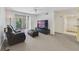 Spacious living room featuring neutral carpet and an entertainment center, perfect for relaxing or entertaining at 725 Crest Pines Dr # 422, Orlando, FL 32828