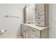 Bathroom featuring a modern vanity with plenty of storage and a light neutral color palette at 7845 Clubhouse Estates Dr, Orlando, FL 32819
