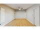 Well-lit bedroom with light hardwood floors and a ceiling fan at 7845 Clubhouse Estates Dr, Orlando, FL 32819