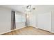 Bedroom with hardwood floors and ample natural light from a window and plenty of closet space at 7845 Clubhouse Estates Dr, Orlando, FL 32819