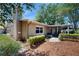 Beautiful home featuring a covered patio and lush landscaping in backyard at 7845 Clubhouse Estates Dr, Orlando, FL 32819