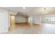 Bright open-plan living room with pristine floors and abundant natural light, perfect for entertaining at 7845 Clubhouse Estates Dr, Orlando, FL 32819