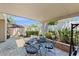 Charming covered patio with brick flooring and outdoor dining set at 7845 Clubhouse Estates Dr, Orlando, FL 32819