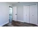 Bedroom with hardwood floors and a connecting hallway at 8 Palm Dr, Ormond Beach, FL 32176