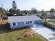 Well-kept home with updated landscaping and a spacious driveway on a sunny day at 8 Palm Dr, Ormond Beach, FL 32176