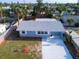 Charming single-story home with a new driveway, mature trees, and a manicured lawn at 8 Palm Dr, Ormond Beach, FL 32176