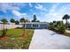 Charming single-story home features a freshly painted exterior, new driveway, and landscaping at 8 Palm Dr, Ormond Beach, FL 32176