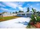Charming single-story home with a well-manicured lawn, updated driveway, and lovely curb appeal at 8 Palm Dr, Ormond Beach, FL 32176
