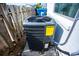 A modern home HVAC unit with energy guide sits between the house and a wooden fence at 8 Palm Dr, Ormond Beach, FL 32176