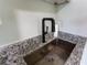 Kitchen featuring stainless steel sink, granite countertops, and black faucet at 8 Palm Dr, Ormond Beach, FL 32176