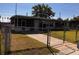Well-maintained home with fenced yard and front walkway at 815 S Solandra Dr, Orlando, FL 32807