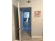 Hallway shot into living area, featuring tile floor and light gray paint at 815 S Solandra Dr, Orlando, FL 32807