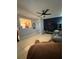 Spacious living room with tile flooring, ceiling fan, and an open view of the kitchen at 815 S Solandra Dr, Orlando, FL 32807