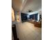 Spacious living room featuring tile flooring, a ceiling fan, and natural light at 815 S Solandra Dr, Orlando, FL 32807