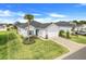 Elevated view of a home showcasing its well-kept lawn, roof, and proximity to neighboring houses at 9132 Sw 57Th Ter, Ocala, FL 34476