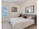 Bedroom with neutral decor, window view, and minimalist style at 9132 Sw 57Th Ter, Ocala, FL 34476