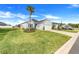 Beautiful one-story home with an attached garage, manicured lawn, and complemented by a tall palm tree at 9132 Sw 57Th Ter, Ocala, FL 34476