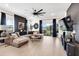 Cozy living room with a large sectional sofa, stylish decor, and a view of the backyard at 9132 Sw 57Th Ter, Ocala, FL 34476