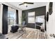 Home office showcasing a modern desk, stylish decor, and large window with natural light at 9132 Sw 57Th Ter, Ocala, FL 34476