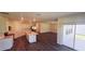 Spacious kitchen with stainless steel appliances and an island opens to a large living area at 1032 Morfontaine St, Daytona Beach, FL 32124