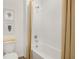 Bathroom featuring a clean white bathtub and shower, complemented by stylish decor and modern fixtures at 1035 Morfontaine St, Daytona Beach, FL 32124