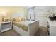 Inviting bedroom featuring a cozy bed with decorative pillows, a nightstand, and soft lighting at 1035 Morfontaine St, Daytona Beach, FL 32124
