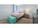 Charming bedroom with a cozy bed, colorful accents, and ample natural light for a restful space at 1035 Morfontaine St, Daytona Beach, FL 32124