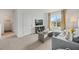 Comfortable living room featuring a gray couch, modern decor, and a view into the laundry room at 1035 Morfontaine St, Daytona Beach, FL 32124
