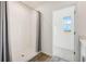 Modern tiled shower stall with sleek fixtures and a clear glass door adds a touch of luxury to the bathroom at 1035 Morfontaine St, Daytona Beach, FL 32124