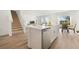 Bright kitchen featuring an island with stainless steel dishwasher, sink and modern fixtures at 1039 Morfontaine St, Daytona Beach, FL 32124