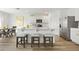 Bright, modern kitchen with an island, seating, stainless steel appliances, and sleek countertops at 1039 Morfontaine St, Daytona Beach, FL 32124