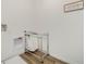 Functional laundry area featuring a laundry hamper, wall-mounted fixtures, and wood-look flooring at 1039 Morfontaine St, Daytona Beach, FL 32124