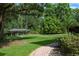A charming boat dock and lift in the backyard by the water at 10849 Emerald Chase Dr, Orlando, FL 32836