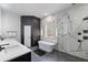 Modern bathroom with a soaking tub, walk-in shower, and double vanity at 10849 Emerald Chase Dr, Orlando, FL 32836