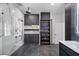 Contemporary bathroom with a glass-enclosed shower, storage cabinet, and floating shelves at 10849 Emerald Chase Dr, Orlando, FL 32836