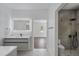 Well-lit bathroom featuring modern vanity, walk-in shower, and neutral colors at 10849 Emerald Chase Dr, Orlando, FL 32836