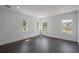 Bright bedroom with hardwood floors, recessed lighting, and multiple windows at 10849 Emerald Chase Dr, Orlando, FL 32836
