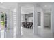 Bright dining room with elegant columns, modern decor, and ample natural light at 10849 Emerald Chase Dr, Orlando, FL 32836