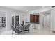 Elegant dining area with a glass table, seating for six, and a stylish bar area at 10849 Emerald Chase Dr, Orlando, FL 32836