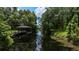 A daytime shot of the boat dock and lift on the water at 10849 Emerald Chase Dr, Orlando, FL 32836