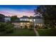 The beautiful exterior view of the home at dusk at 10849 Emerald Chase Dr, Orlando, FL 32836