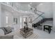 Expansive foyer featuring a glass-enclosed staircase, gleaming floors, and abundant natural light at 10849 Emerald Chase Dr, Orlando, FL 32836