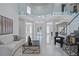 Spacious foyer with high ceilings, glass balcony, and modern finishes for a grand entrance at 10849 Emerald Chase Dr, Orlando, FL 32836