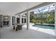 The screened pool has a nice seating area and covered patio at 10849 Emerald Chase Dr, Orlando, FL 32836